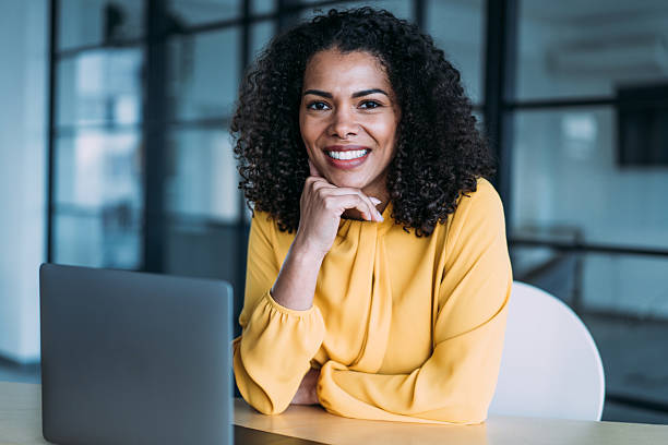 istock Successful businesswoman in modern office working on laptop. 2237561515
