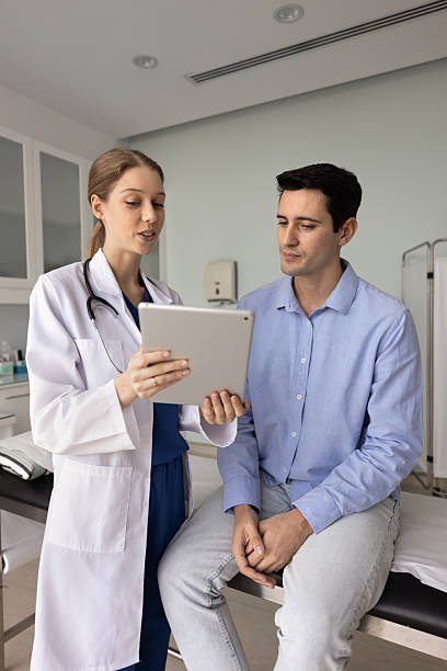 istock Positive young female doctor explaining electronic medical report 2237561551