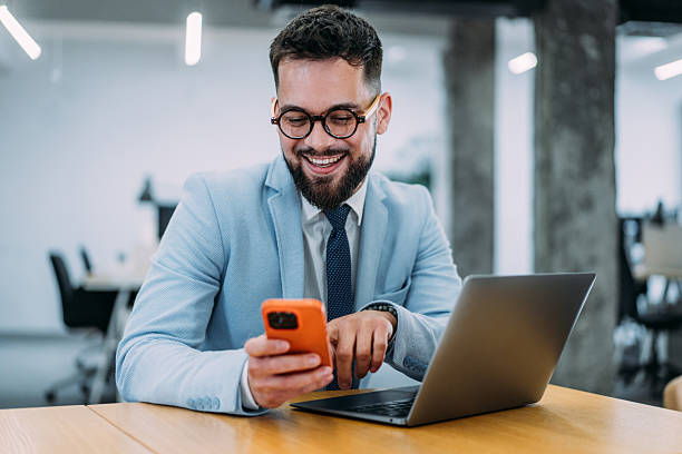 istock Successful businessman in modern office working on laptop. 2237562102