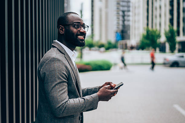 istock Businessman texting outdoors. 2237562996