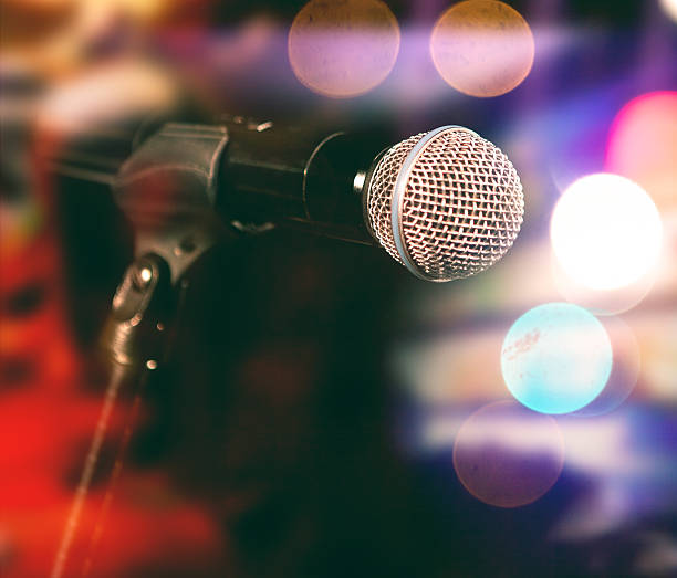 istock Microphone and stage lights.Concert and music concept. 2237563087