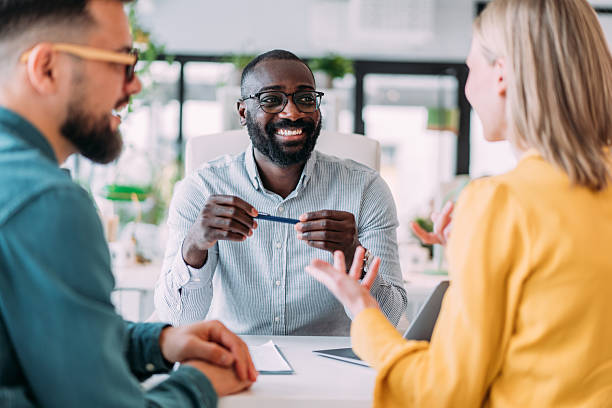 istock Group of business persons talking in the office. 2237565741