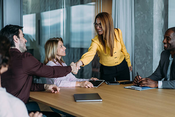 istock Businesspeople shaking hands across the table. 2237566976