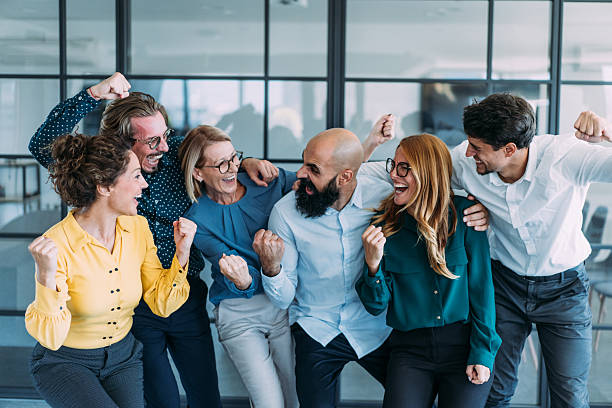 istock Cheerful entrepreneurs celebrating success in the office. 2237568290