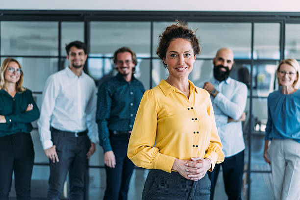 istock Confident businesswoman and her team. 2237568296