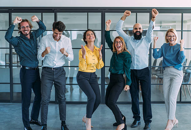 istock Cheerful entrepreneurs celebrating success in the office. 2237568319