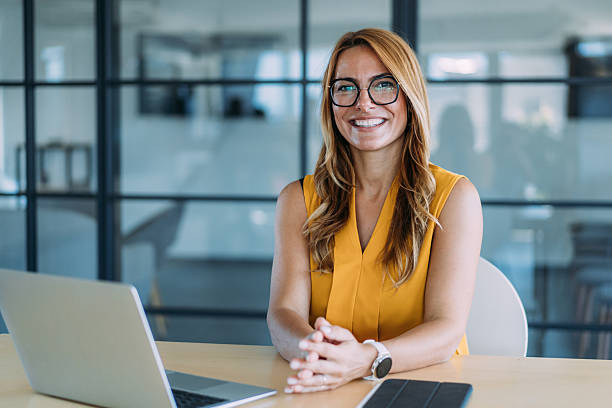 istock Successful businesswoman in modern office working on laptop. 2237568335