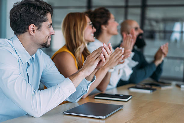 istock Businesspeople applauding during a seminar in conference hall. 2237568353
