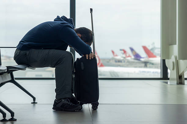 istock A man sleeping at the airport 2237568593