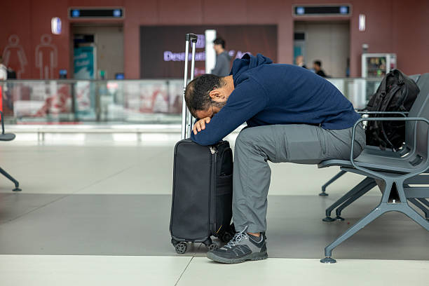 istock A man sleeping at the airport 2237568624