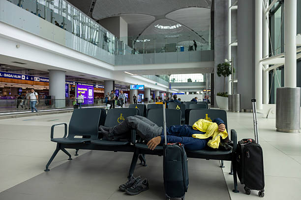 istock A man sleeping at the airport 2237568628