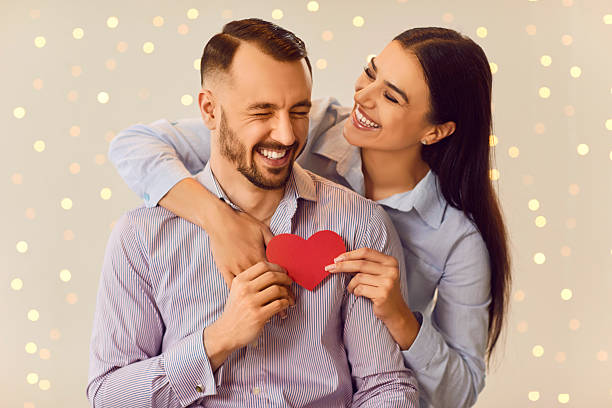 istock Smiling Couple Holding a Red Heart 2237568632