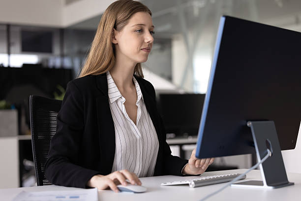 istock Positive focused 20s corporate professional girl working at computer 2237571627