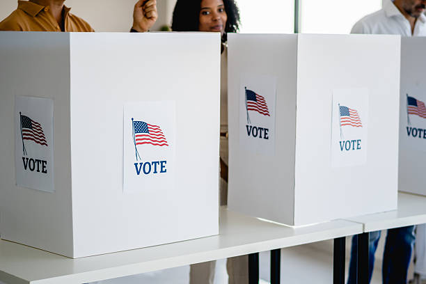 istock People casting their votes at American polling station 2237574155