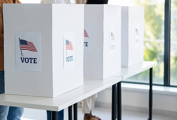 istock People voting in election polling station booths 2237578604