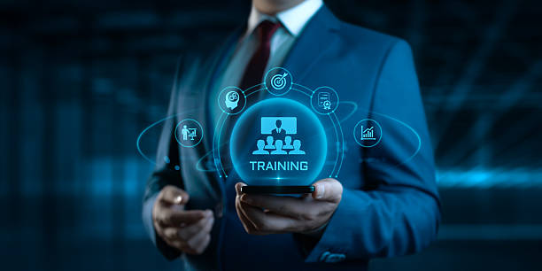 istock Businessman Holding smartphone with Training Icons on Screen. E-Learning and online Education concept 2237585406