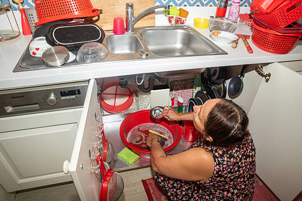 Close up view of dirty dishes in the sink in the kitchen
