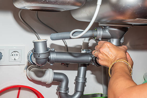 istock Woman placing plastic sink gasket under sink 2237595082