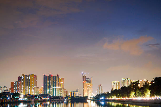 istock Manila's illuminated skyline reflected on the Pasig River at twilight offers a captivating urban landscape showing the beauty of the city at nightfall. Urban cityscape with illuminated towers 2237601738