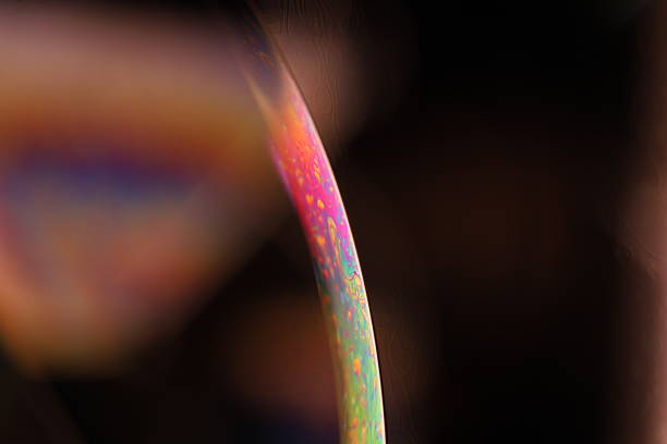 istock Colourful liquid film, one curved line on dark background 2237603604