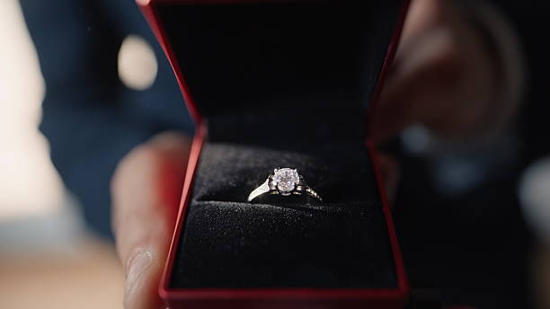 istock Hands presenting love gift in private bright setting closeup. Proposal scene 2237604451