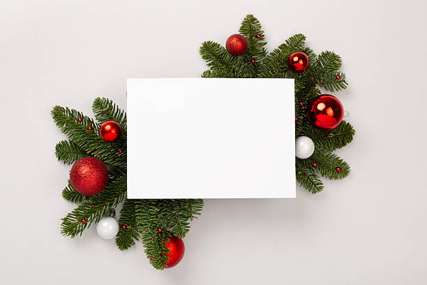 istock Festive Christmas tree branches with mock up black on color background, top view 2237608264
