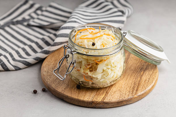 istock Pickled cabbage. Sauerkraut with carrots in a glass jar. 2237609449