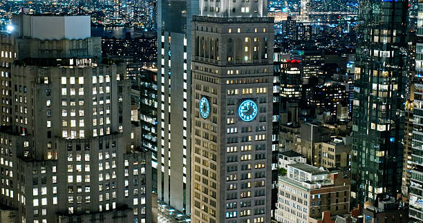 Aerial shot of a clock tower in Midtown Manhattan, New York City at night.Authorization was obtained from the FAA for this operation in restricted airspace.