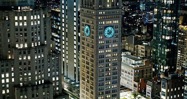 Aerial shot of a clock tower in Midtown Manhattan, New York City at night.Authorization was obtained from the FAA for this operation in restricted airspace.