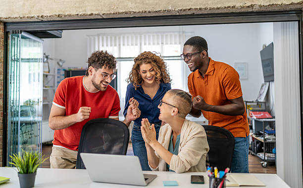 istock Diverse startup team celebrating business success in modern office 2237612495