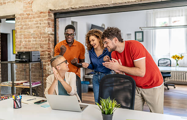 istock Diverse business team celebrating success in office 2237613415