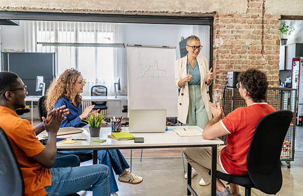 istock Business people applauding during meeting in office 2237613601