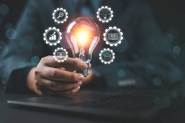istock Invention innovation bulb business technology lamp light connection education electricity. Businessman holding energy interaction features internet power. 2237615883