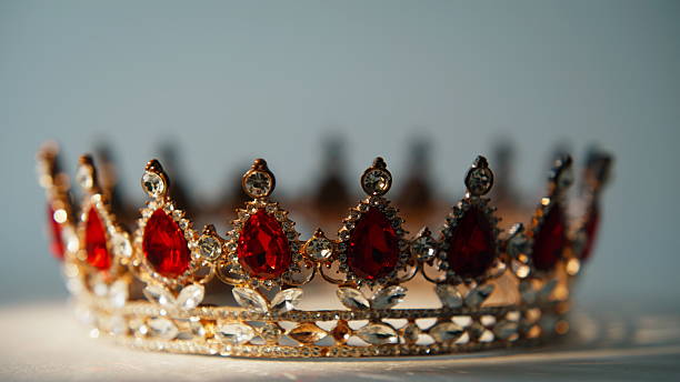 istock Closeup ornate crown placed in silent indoor space. Precious object revealing 2237616177