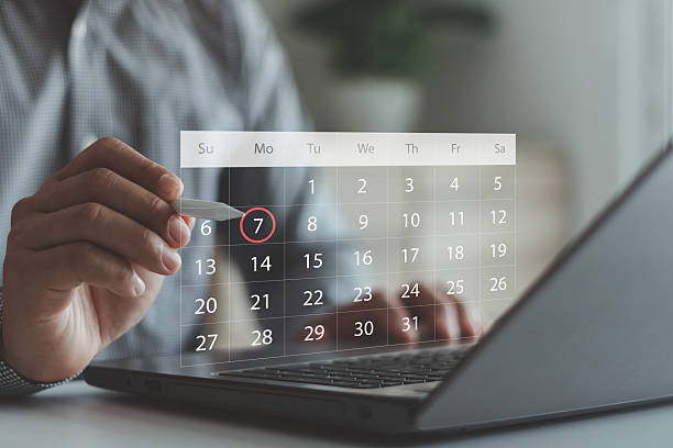 istock Businessman using digital calendar on laptop to schedule an important date. Concept of planning, time management, appointment booking, productivity and digital organization tool. Business technology. 2237620144