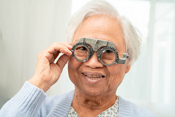istock Optometrist checking Asian elderly woman ophthalmic vision eye test and using optical trial frame. 2237621361