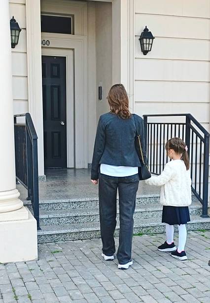 istock Mother and daughter walking together outside 2237621639