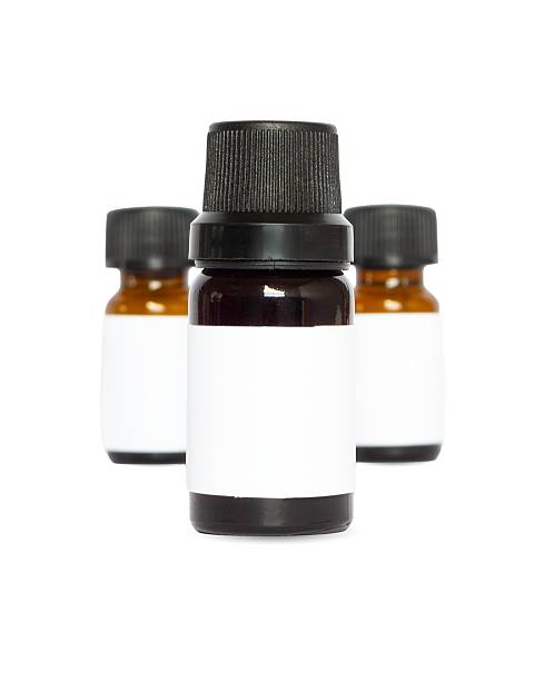 Three Amber Essential Oil Bottles Mockup