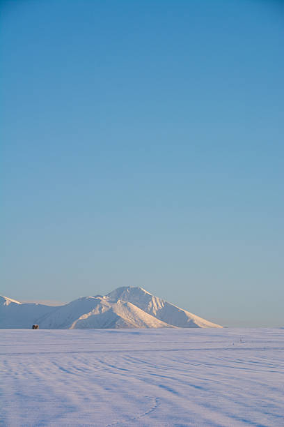 istock Snowfields and snowy mountains at dusk in winter 2237626989