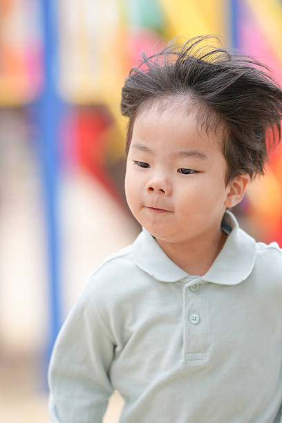 istock A young boy with messy hair 2237633549