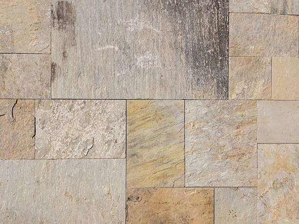 istock Beige natural stone tiles creating an abstract wall texture 2237639023