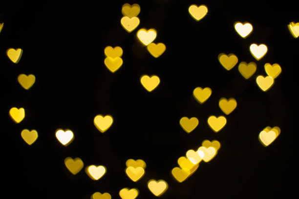 istock Glowing Heart-Shaped Lights Create a Warm and Romantic Atmosphere in a Dimly Lit Space 2237645321