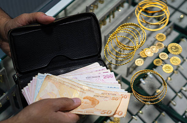 istock Customer counting Turkish Lira banknotes in jewelry store 2237645810