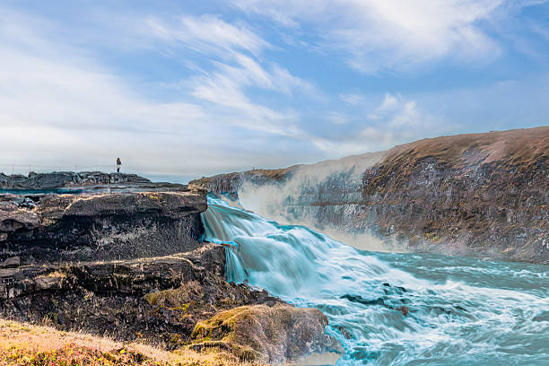 istock Breathtaking Gullfoss falls, located in Iceland’s Golden Circle, featuring misty rapids, rugged basalt cliffs, serene horizon sky, attracting tourists, nature lovers, photographers, and environmental enthusiasts worldwide. 2237648410