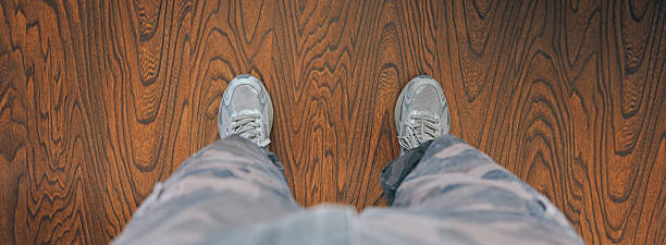 Men Standing on the Hardwood Floor