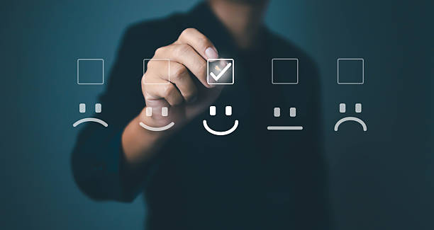istock Hand selecting happy face icon on virtual screen, symbolizing customer satisfaction, positive feedback, user experience, service quality, review rating, and business success improvement. 2237656499