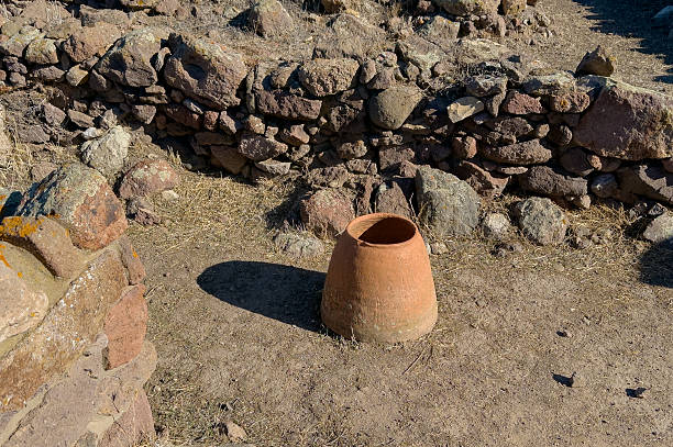 Old terracotta jar inside Monte Sirai ruins, symbol of Phoenician Punic heritage in Sardinia