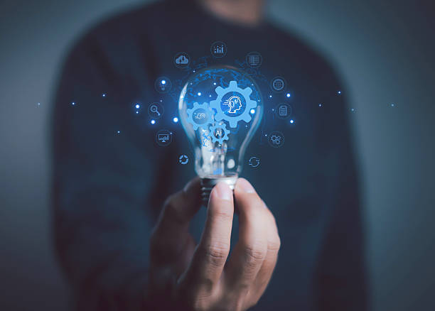 istock Person holding light bulb with AI and gear icons, symbolizing artificial intelligence innovation, technology idea, automation, and digital transformation concept. 2237657416