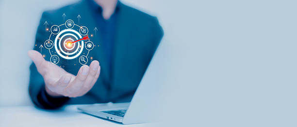 istock Businessman using laptop with virtual target and arrow icon, representing business strategy, digital marketing goal, data analysis, and performance management for successful corporate growth. 2237657608