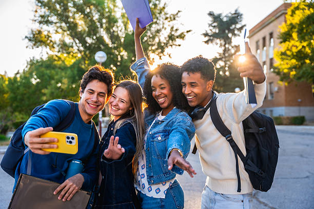 istock Diverse students taking a happy selfie on university campus 2237658750